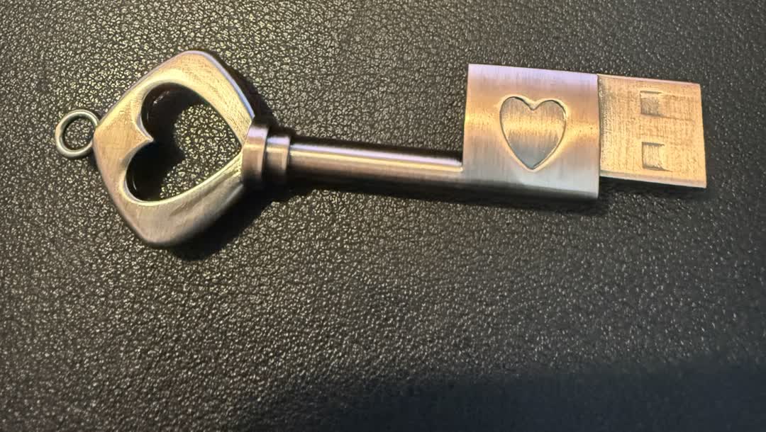 The real Kitty and Co. heart-shaped USB key used to deliver guest recordings