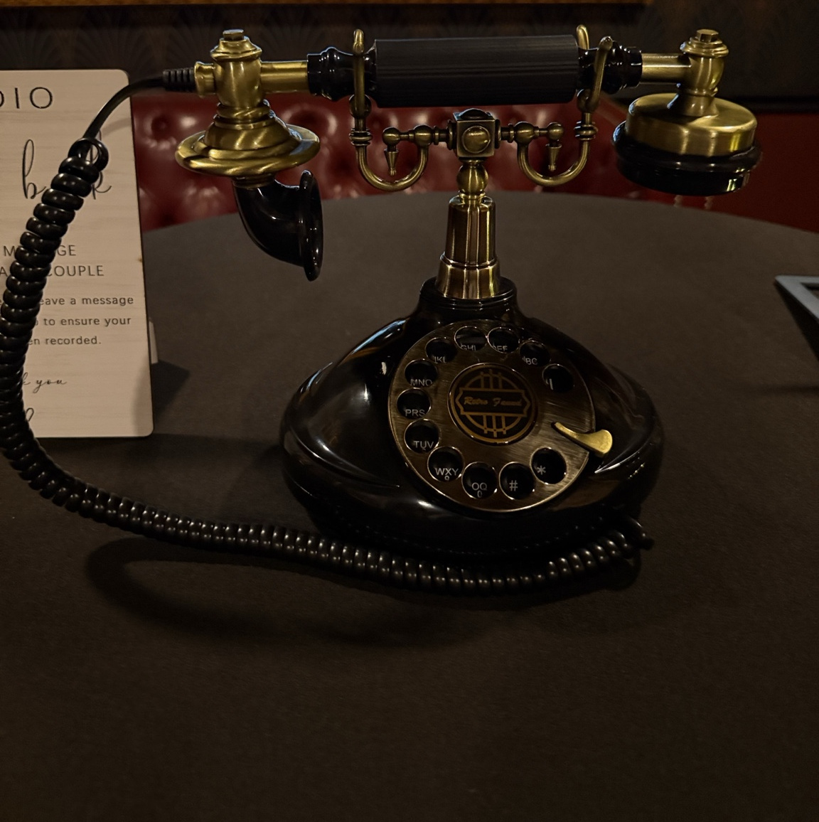 Kitty and Co. vintage black and gold guestbook phone at a real event