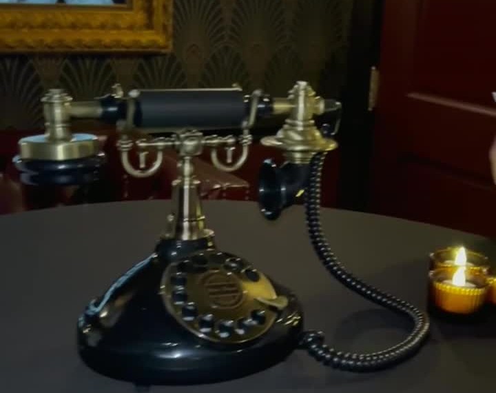Kitty and Co. vintage black and gold guestbook phone at a real event
